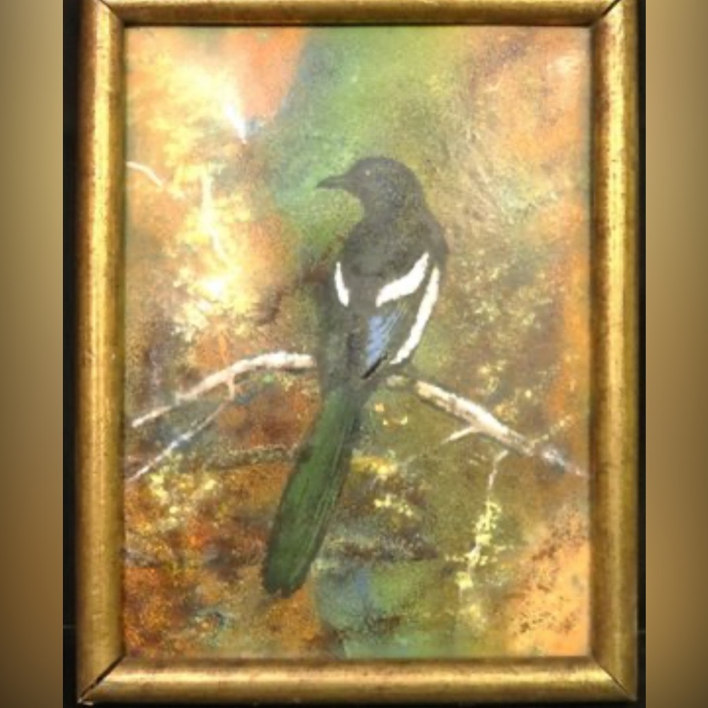 Framed enamel, drawing of bird on branch with a gold frame